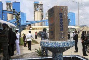 Security officials wait outside a building after Nigeria's President Goodluck Jonathan unveiled a plaque during a commissioning ceremony at Dangote cement factory in Obajana in Nigeria's central state of Kogi June 11, 2012. REUTERS/Akintunde Akinleye