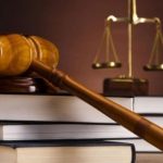 A Gavel on a pile of books