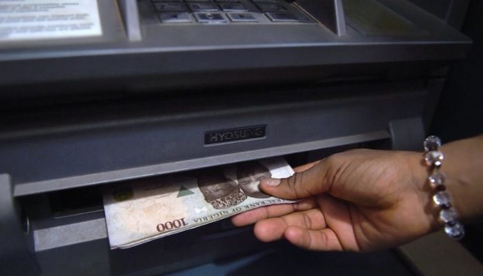 An ATM dispensing money