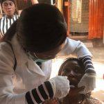 Doctors and students attending to beneficiaries of the free Taiwo Afolabi Community Dentral Outreach.