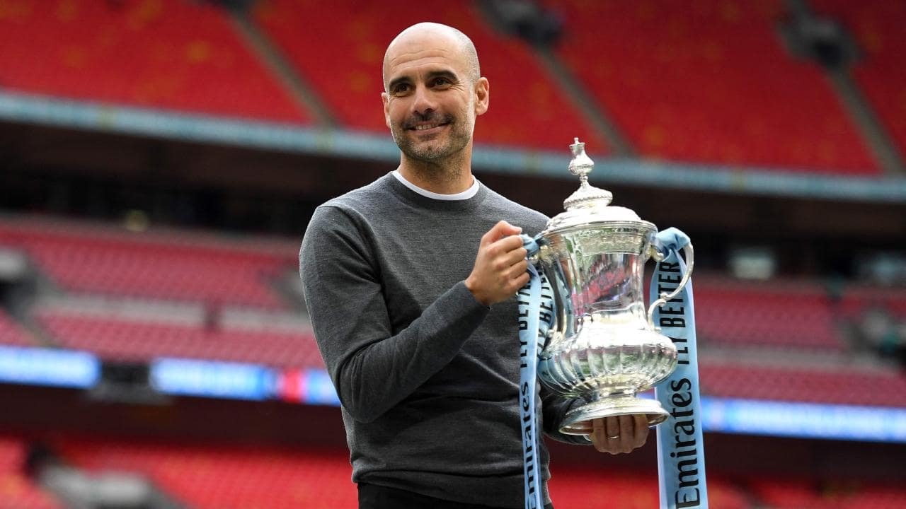 Pep Guardiola completes domestic treble with Manchester City
