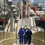 Oil slides as US stockpiles grow