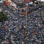Hong Kong protesters rally in defiance of Beijing