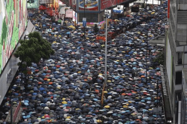 Hong Kong protesters rally in defiance of Beijing