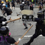 Hong Kong police fire tear gas as protesters hurl petrol bombs