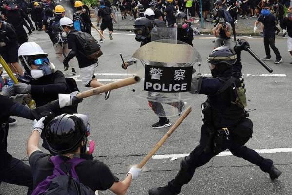 Hong Kong police fire tear gas as protesters hurl petrol bombs