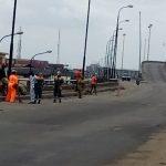 LAWMA officials at work on Apapa Bridge as trucks celebrate with Muslim faithful 