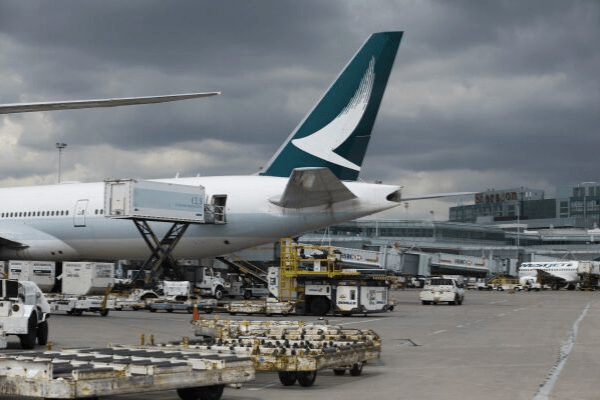 Cathay Pacific hit as protesters flood back into Hong Kong airport