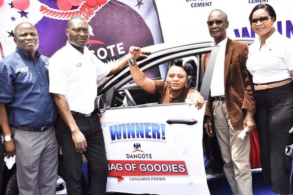 500 persons receive cars, tricycles, other items from Dangote cement
