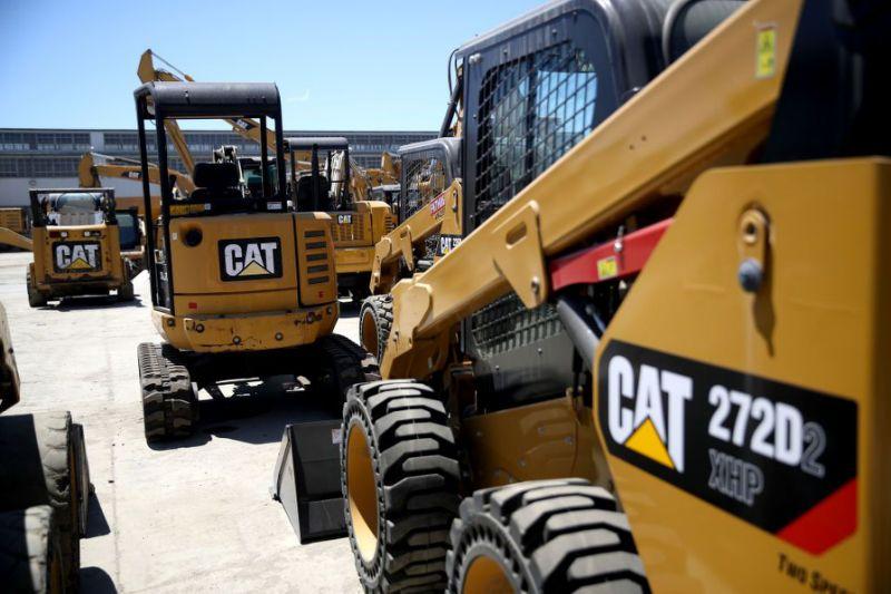 Caterpillar cuts outlook and posts quarterly profit decline