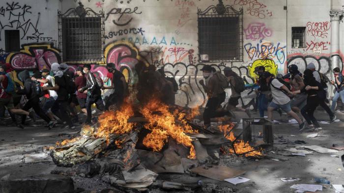 Chile’s Piñera apologises and unveils reforms in bid to quell protests