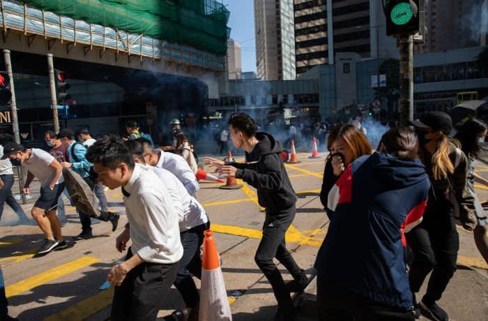 Hong Kong hit by fierce clashes after police shoot protester