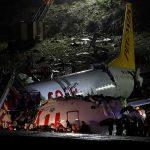 Plane skids off the runway, splits into two