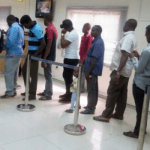 Nigerians looking for new naira queue up at ATMs