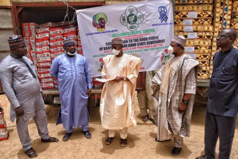 Mohammed Garba (c) Kano State commissioner for Information, receiving the relief materials donated by Gala Investment Limited, while, on the left side, is Oke Godwin, human resources manager; Ali N. Abdallah, admin manager, and Muhammad Danazumi, marketing manager of the company.