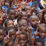 "a group of black children together"