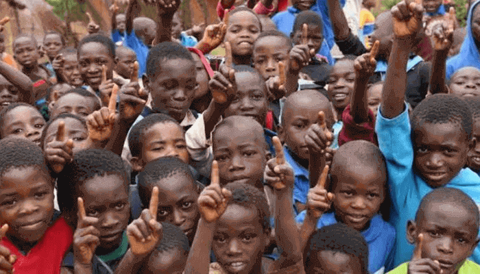 "a group of black children together"