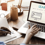 "A man using a laptop"