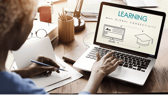 "A man using a laptop"