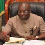 "Ikpeazu writing in his office"