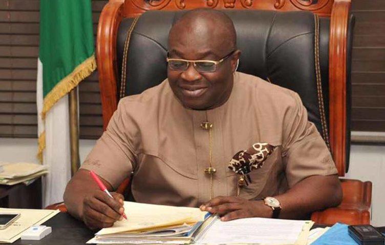 "Ikpeazu writing in his office"