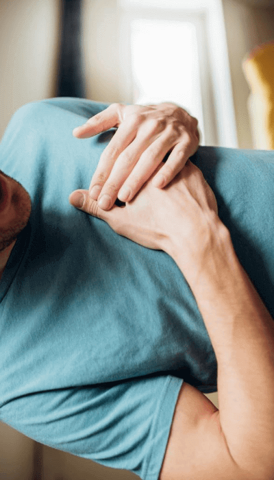 A man holding his chest