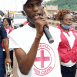 "Red cross representative giving a speech"