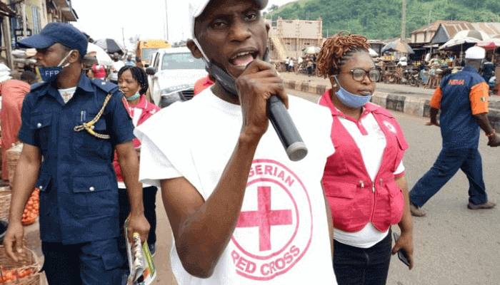 "Red cross representative giving a speech"