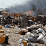 "violence as houses are on fire and town in chaos"