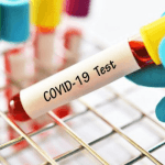 "test tube with COVID-19 Test written on it"