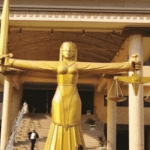 "lady justice in front of a court house