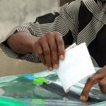 A woman casting her vote