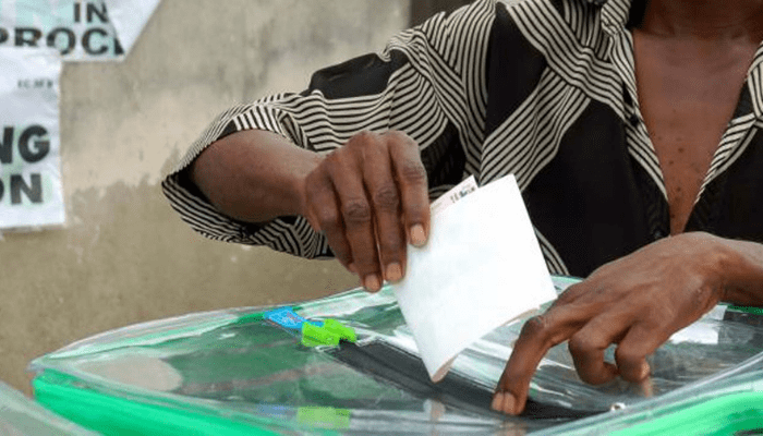 A woman casting her vote