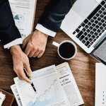 "A white man working on his laptop"