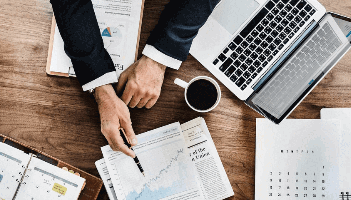 "A white man working on his laptop"