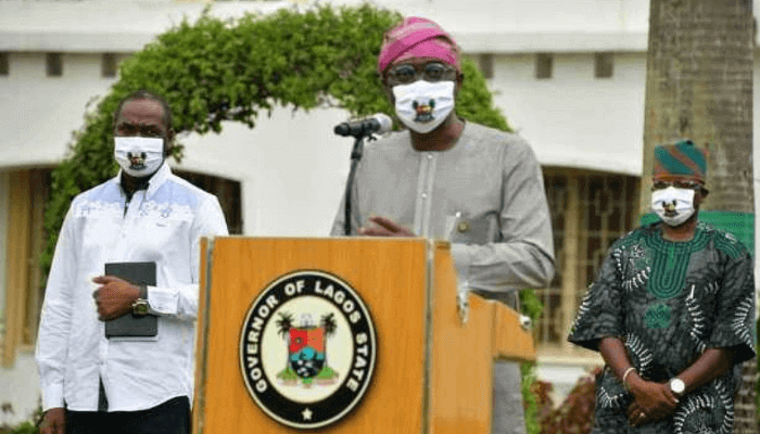 A man speaking in front of a microphone