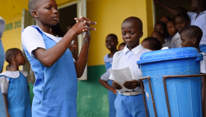 students washing their hands