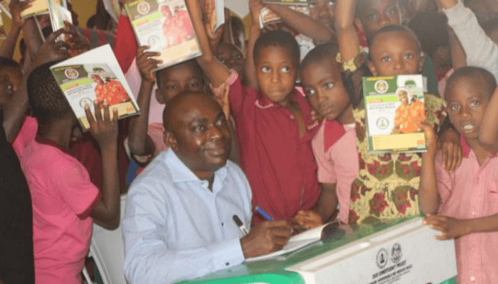 Uko Nkole with children in a class