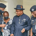 Gov Udom and two policemen