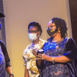 Olubunmi Ajayi (2nd r), wife of the publisher/CEO, MARKETING EDGE, presenting the Outstanding Digital Lending Company of the Year 2021 award to Otimeyin Igbene (l), CEO, Liberty Assured Limited.