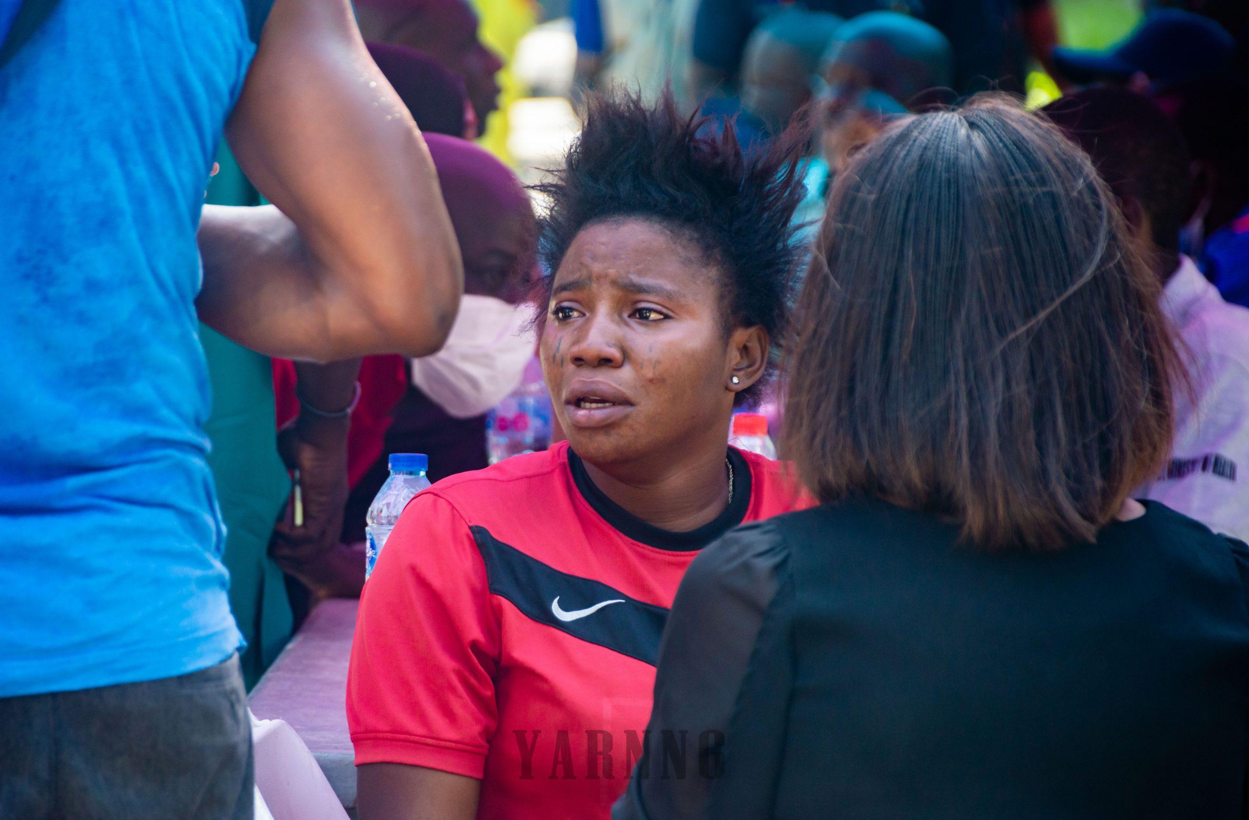 A family member of a victim yet to see her relative receives counselling.