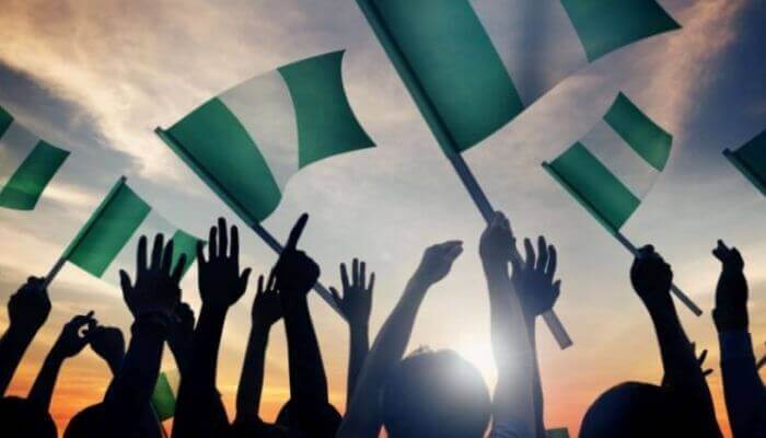 Nigerians waving flags