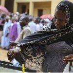 A woman casting her vote