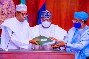President Muhammadu Buhari signs the Electoral Act Amendment Bill into Law