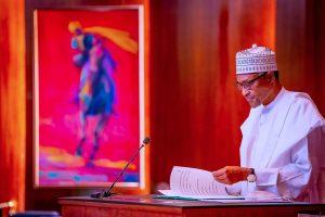 Muhammadu Buhari signs the Electoral Act Amendment Bill