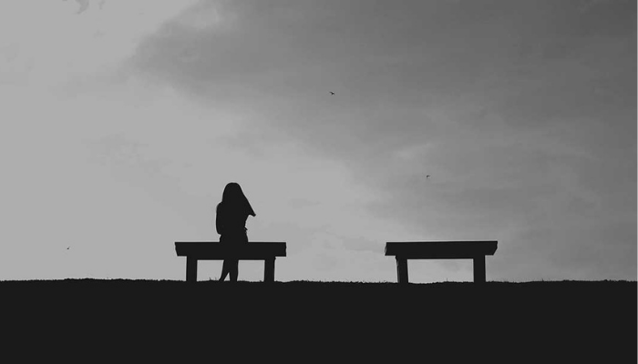 A lady sitting alone