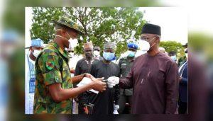 Nasarawa State Governor handing key to patrol venicles the military 