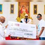 Onosajerhe being presented with One million naira cheque