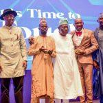 Romeo Oriogun flanked by other winners and some dignitaries at the award night in Lagos