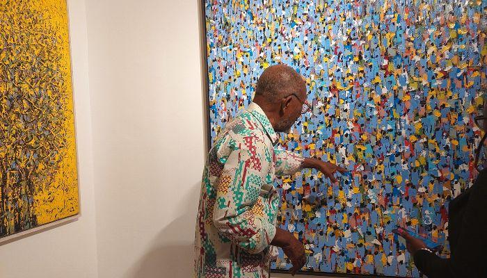 Ablade Glover, explaning his work at the opening day of the exhibition